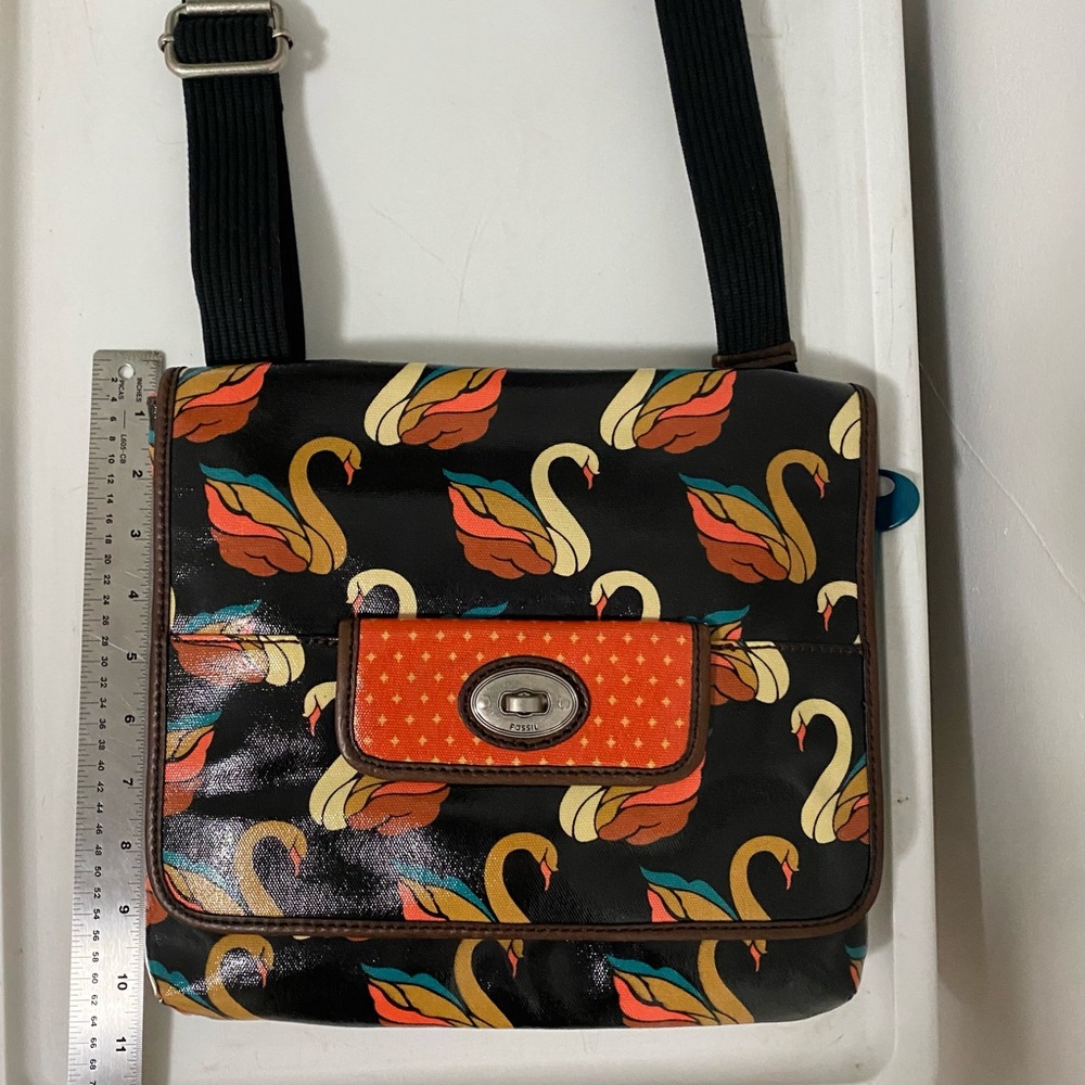 New Fossil swan purse teal salmon on black back background. Brass hardware